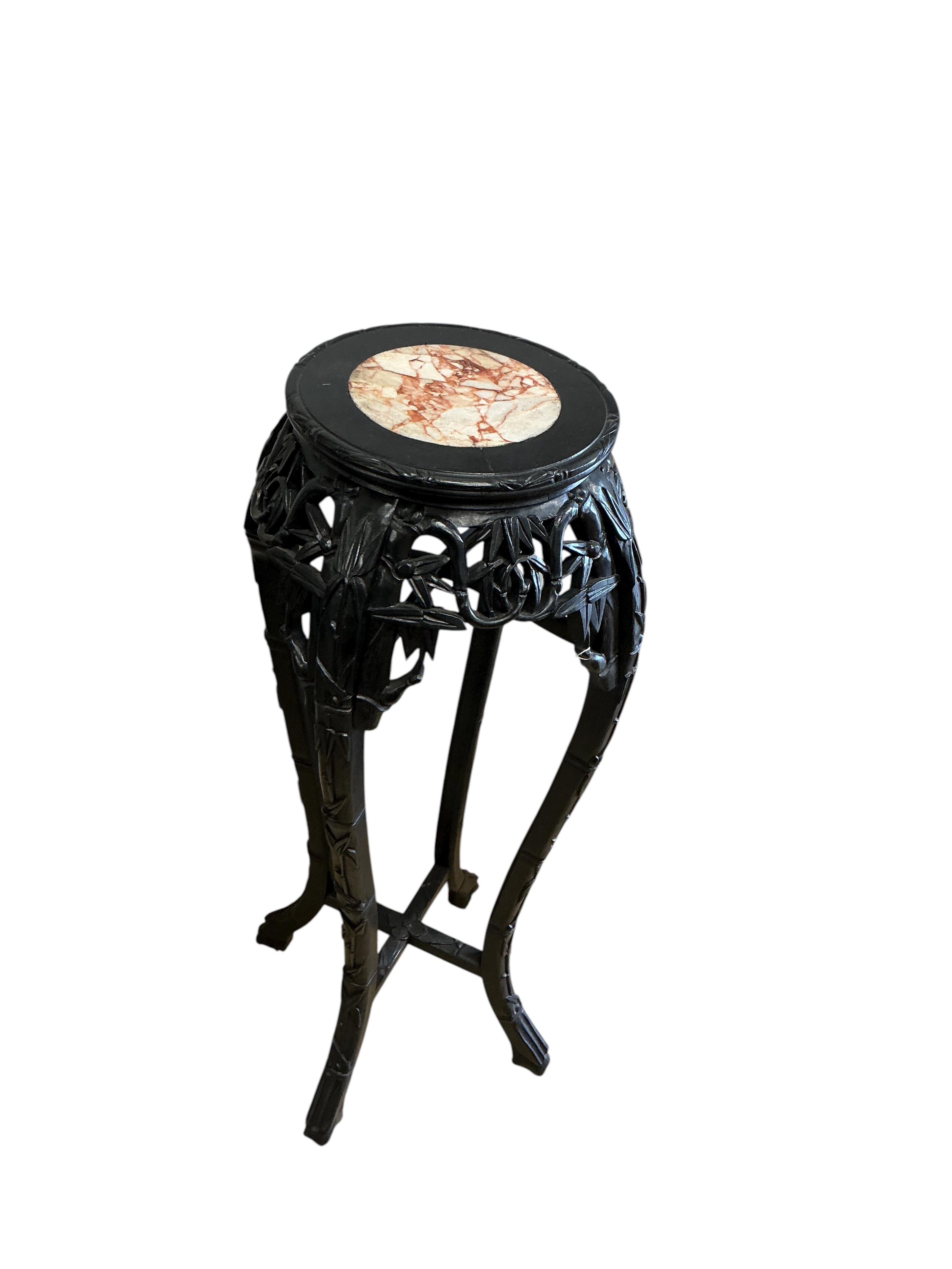 A Chinese marble topped vase stand, diameter 34cm, height 90cm